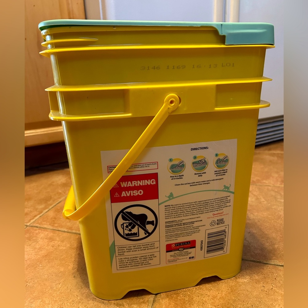 empty plastic bucket with handle and cover yellow green